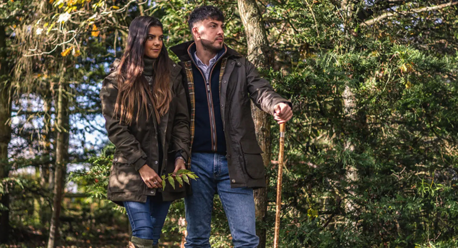 Couple enjoying a country lifestyle stroll in the woods for the AW24 Campaign.