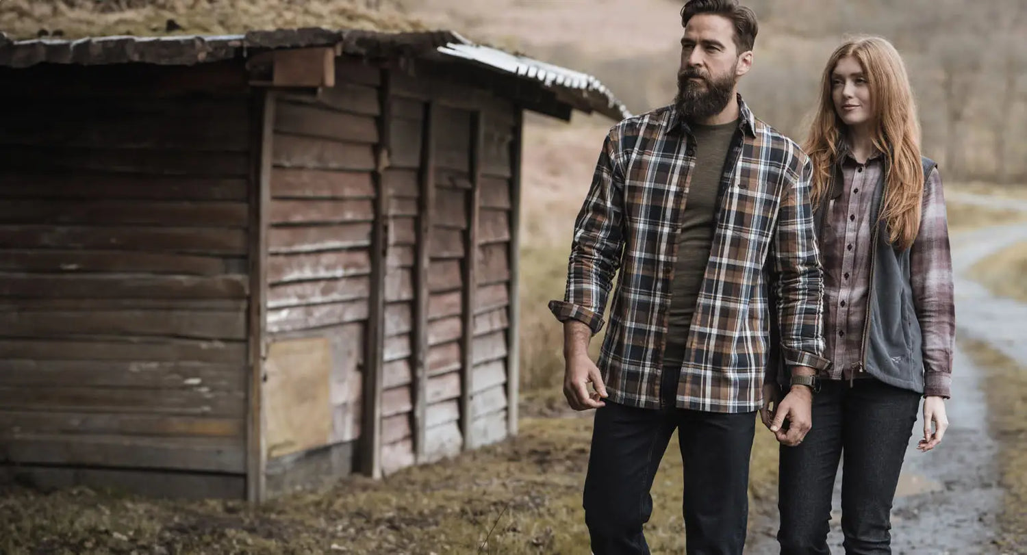 Couple in casual outdoor wear showcasing Fife shirts’ quality craftsmanship for farm work.