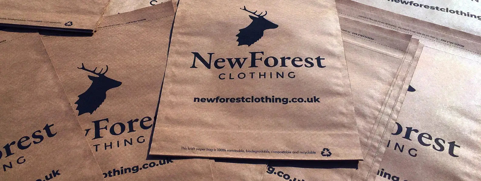 Shipping packages featuring NewForest Clothing logo, a green packaging solution to cut carbon footprint.