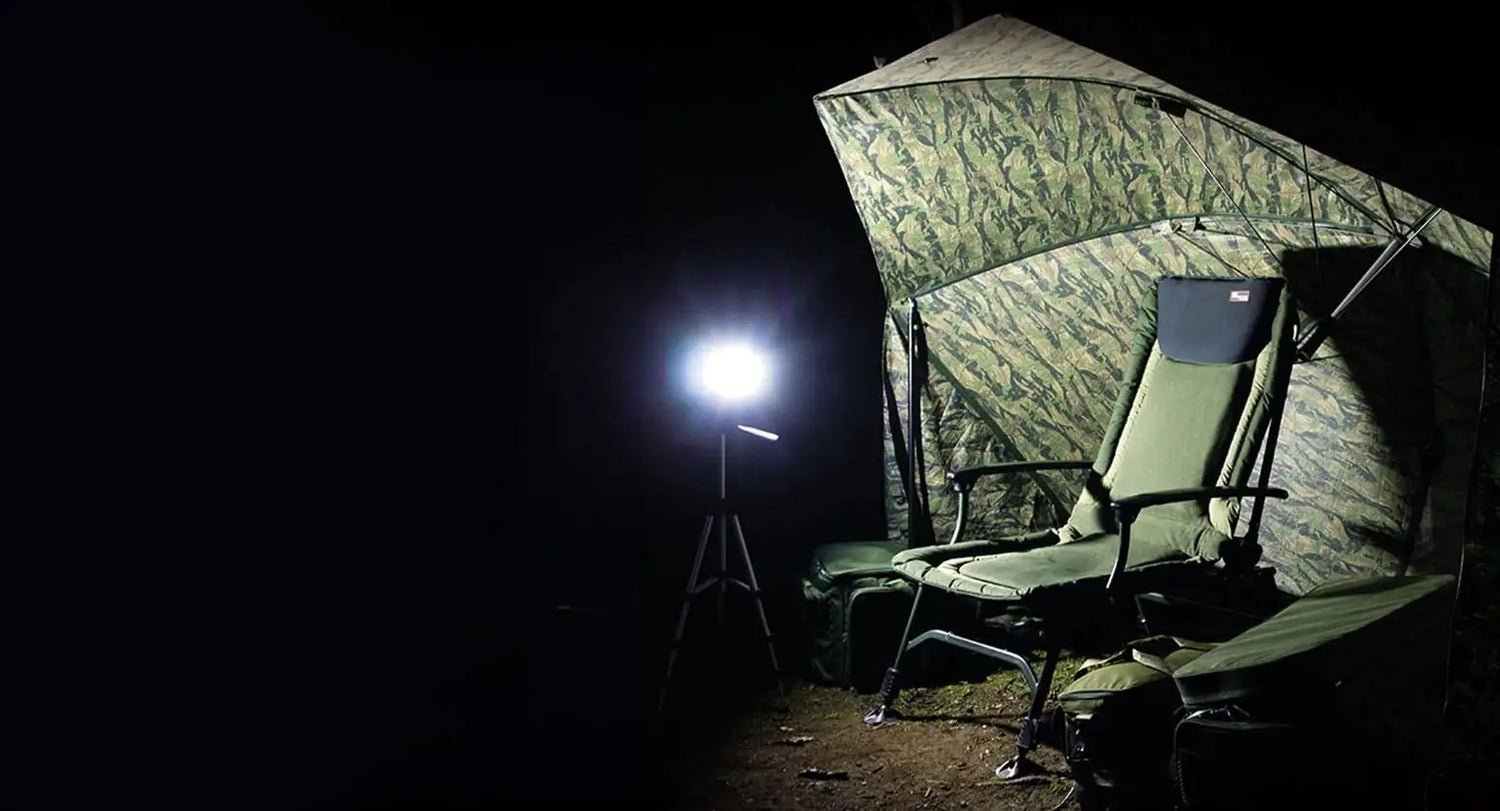 Camping tent and folding chair ready for fishing adventures with NGT’s gear.