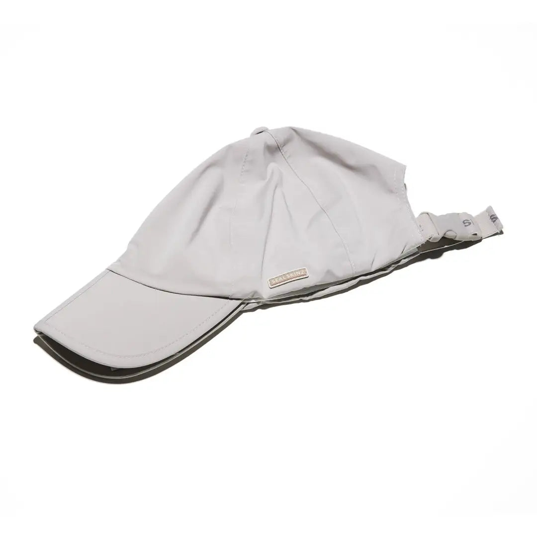 Light gray Sealskinz Salle Cap with a flexible brim, perfect for stylish adventures