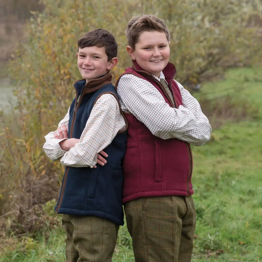 Two boys in Alan Paine Ilkley Kids Shirts, standing back-to-back outdoors