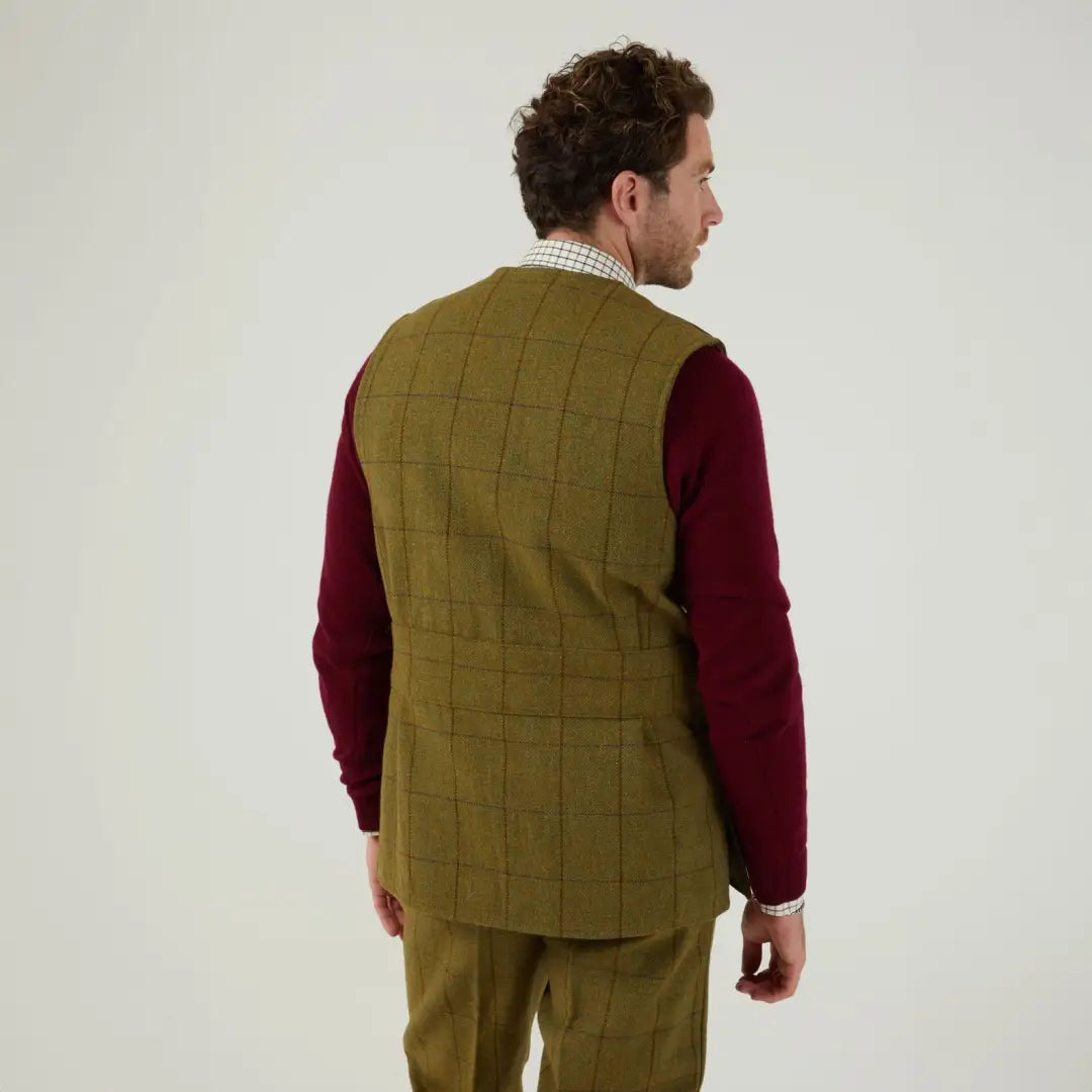 Quilted olive green vest over a burgundy sweater, perfect for shooting, by Alan Paine