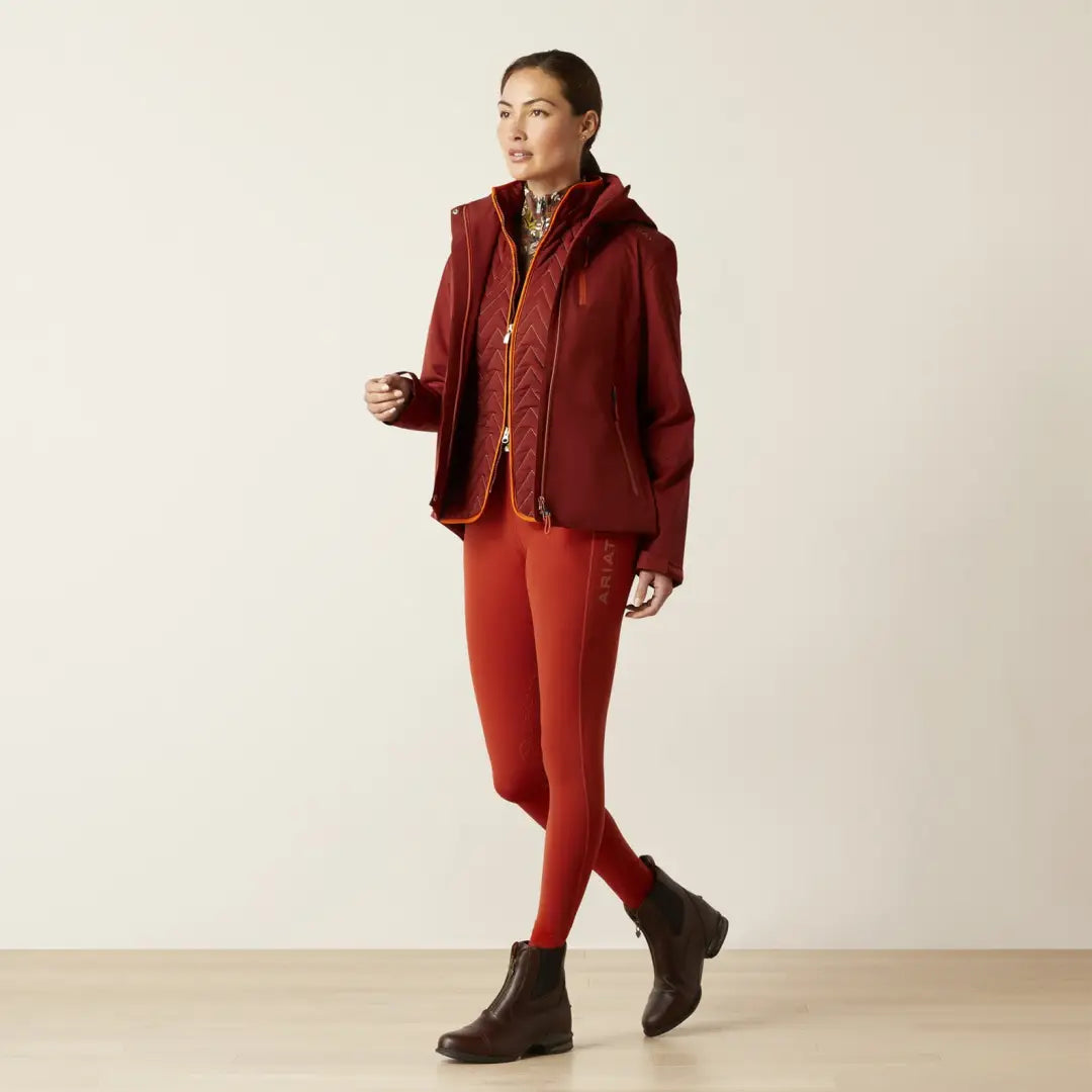 Woman in a stylish red jacket and pants, perfect for country clothing outdoors adventures