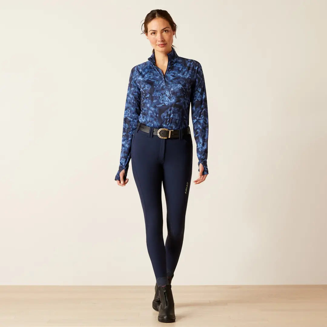 Woman in a blue patterned shirt and navy pants, perfect for country clothing or outdoors fun