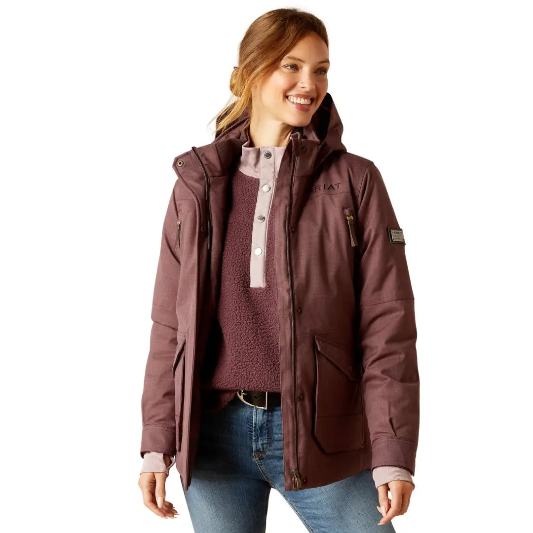 Smiling woman in Burgundy Ariat Sterling Waterproof Insulated Parka with fleece lining