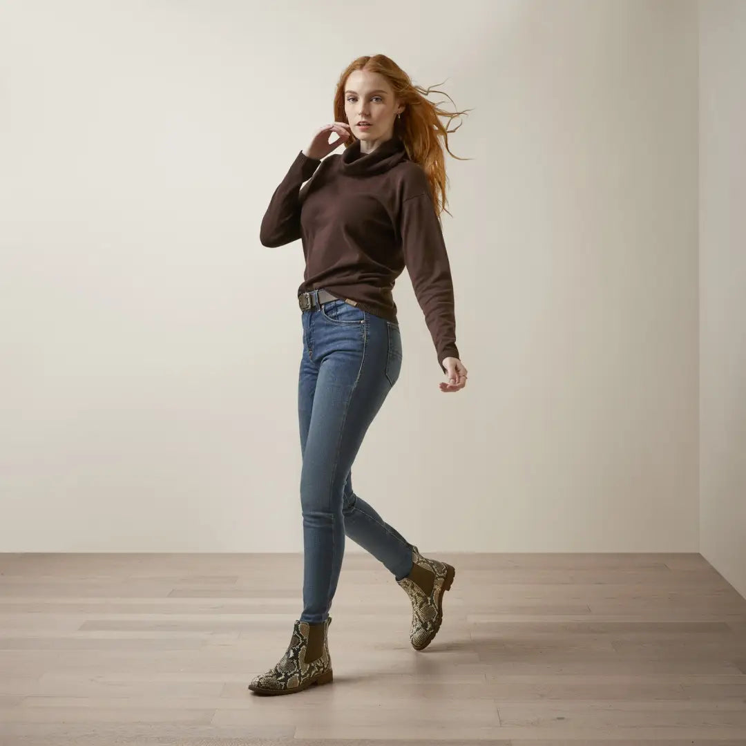 Woman in a brown Ariat Lexi Sweater, perfect for country clothing and outdoor adventures