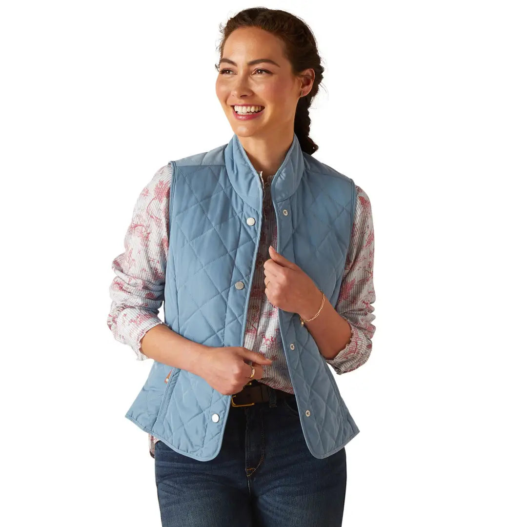 Light blue quilted vest over floral shirt, a special piece inspired by the Ariat Woodside collection