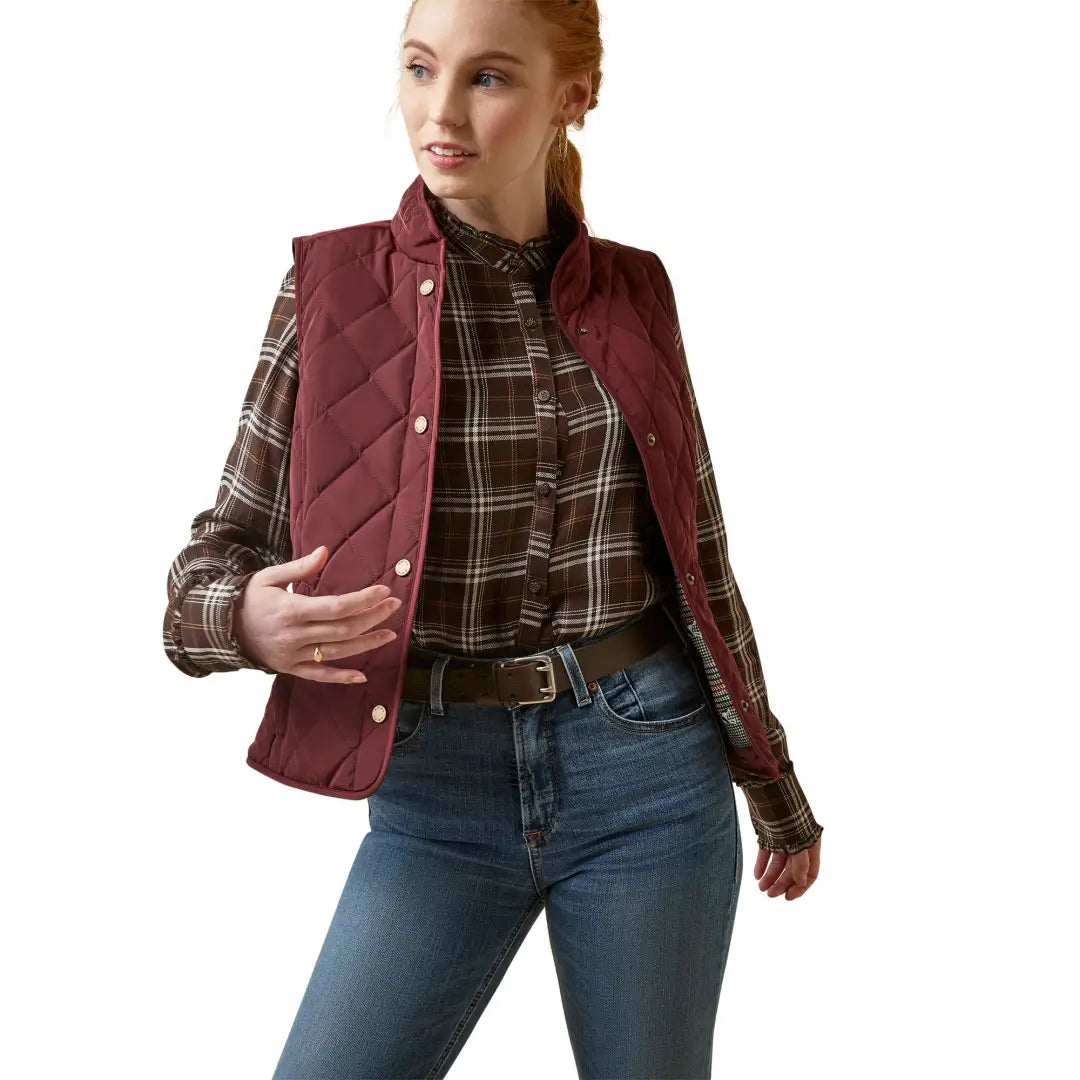 Burgundy quilted Woodside Vest over plaid shirt and jeans for a stylish look