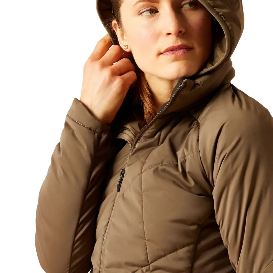 Person wearing a neutral brown Ariat Zonal Insulated Jacket for winter warmth