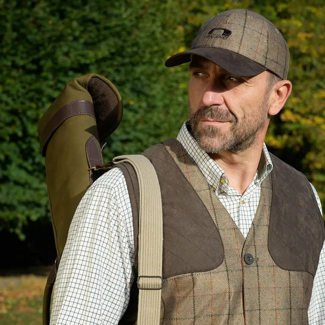 Middle-aged man in outdoor gear showcasing the Baleno Edward Printed Tweed Cap