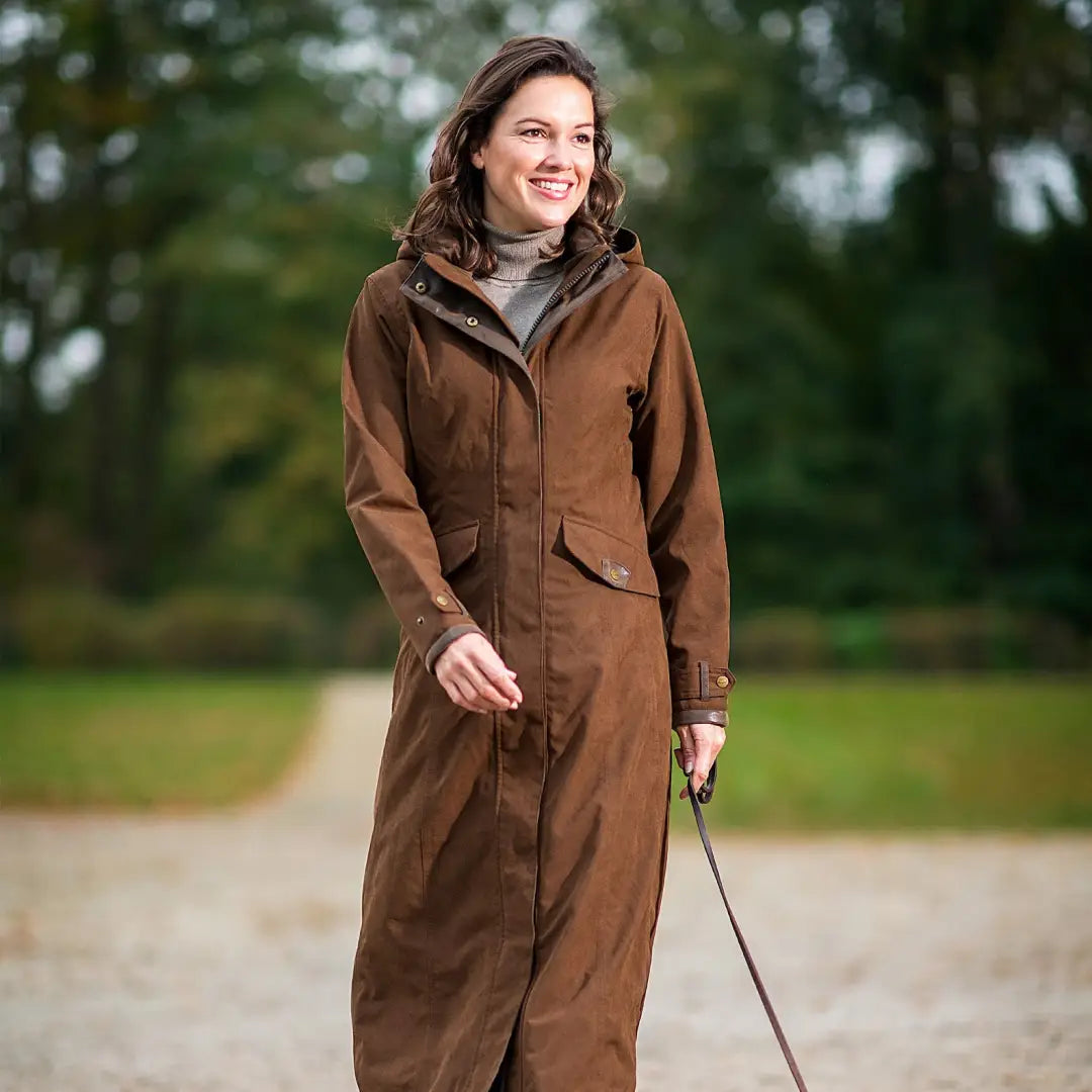 Smiling person in Baleno Kensington Ladies jacket outdoors, perfect for country clothing