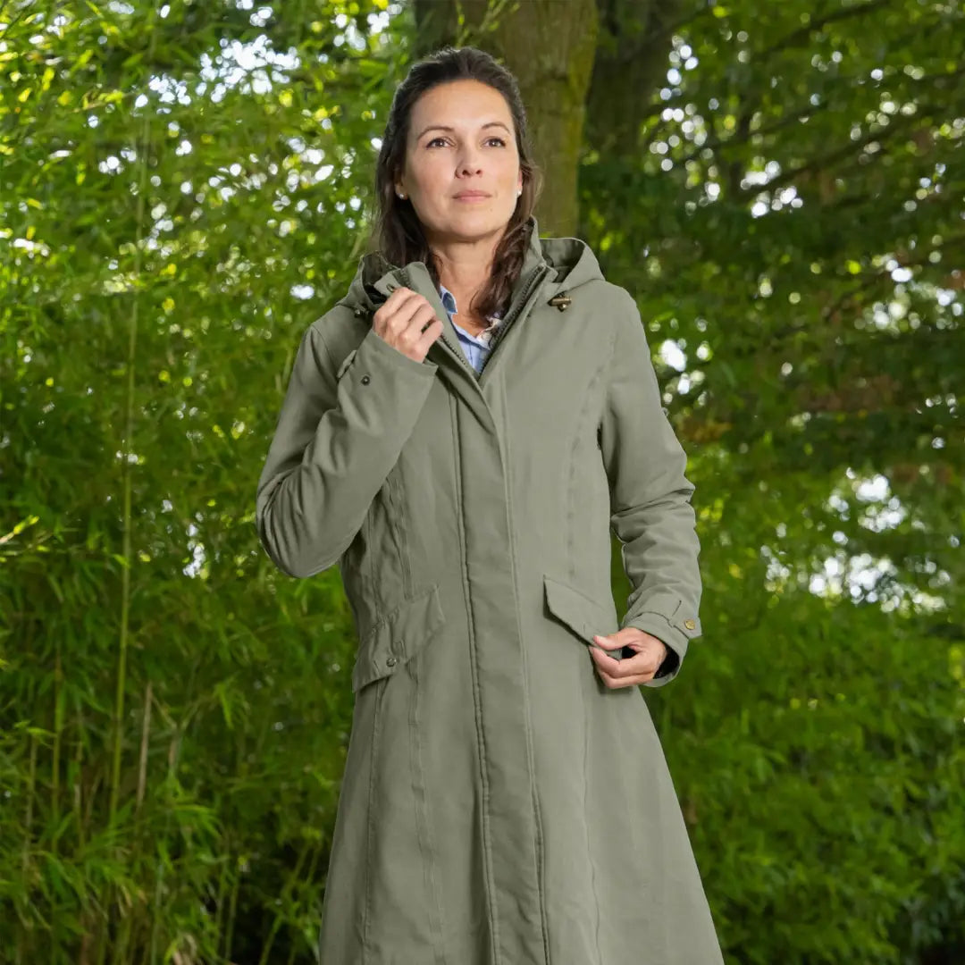 Woman wearing a Baleno Kensington Safe longer length raincoat outdoors