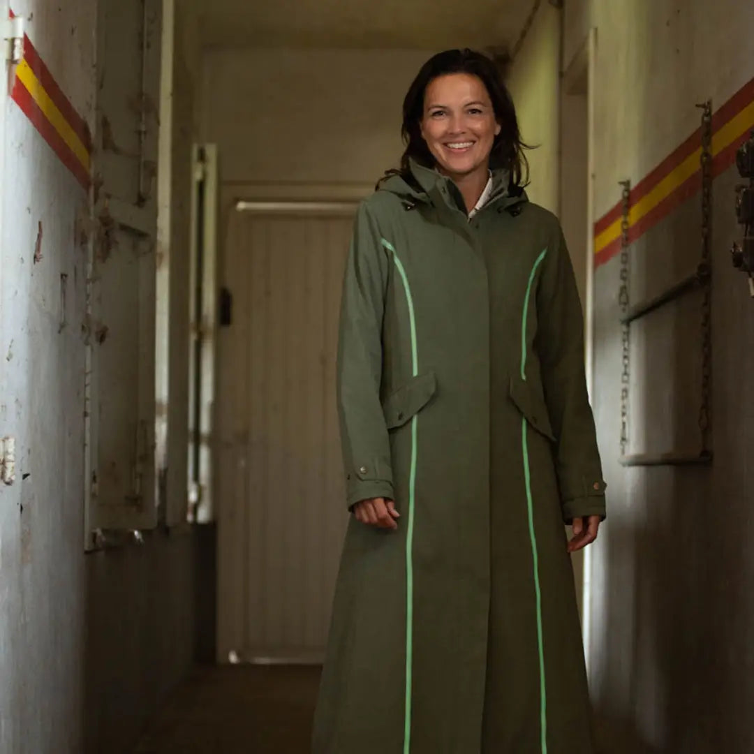 Woman in a long green coat, showcasing the Baleno Kensington Safe Ladies jacket