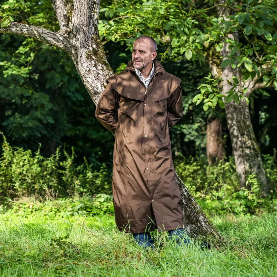 Man wearing Baleno Newbury Mens Full Length Coat in brown leather outdoors