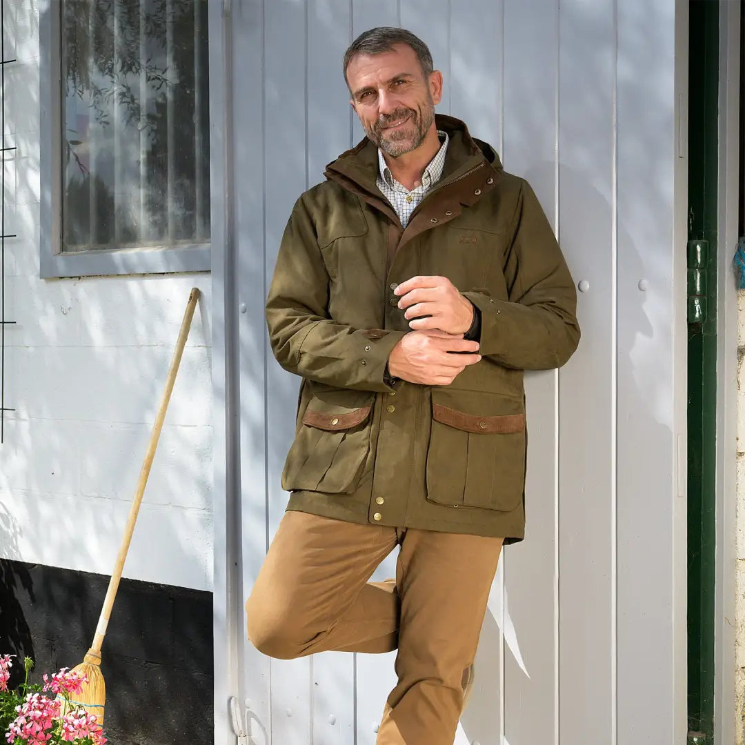 Middle-aged man in olive green Baleno Oakwood Waterproof Jacket with detachable hood