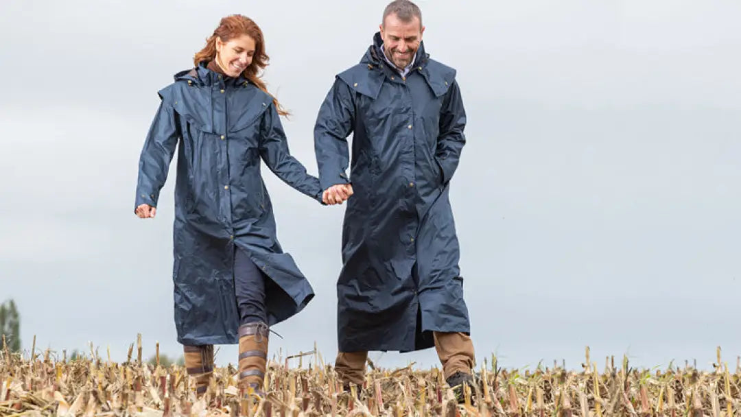 Two people in Long Waterproof Baleno Oxford Women’s Coats walking in a field