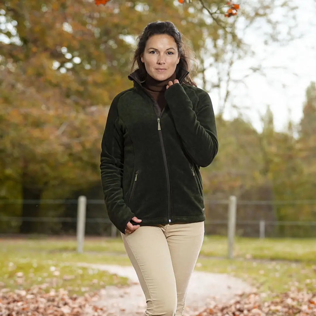 Woman in dark green Baleno Southwell Ladies Waterproof Fleece jacket in autumn leaves