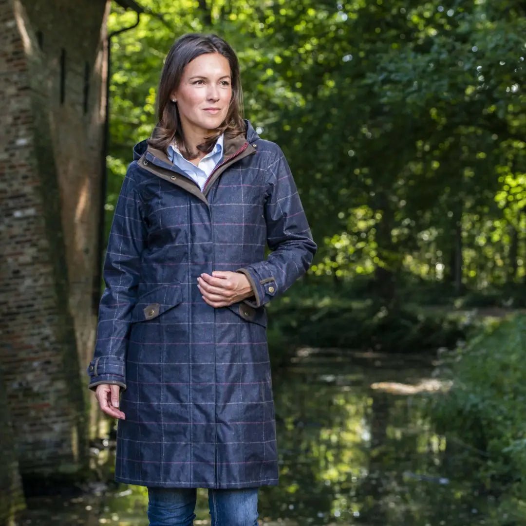 Navy blue quilted coat with a hood, perfect in the outdoors for stylish technical printed wear