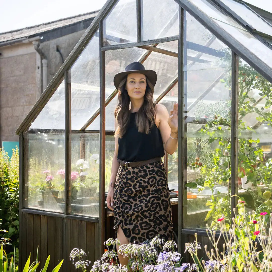 Greenhouse with glass panels and wooden frame, perfect for outdoor fun in a Sundowner Kangaroo Leather Hat