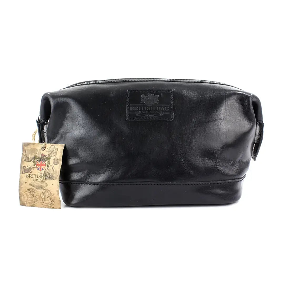 Black leather toiletry bag from the Oakham Collection Washbag with attached tag