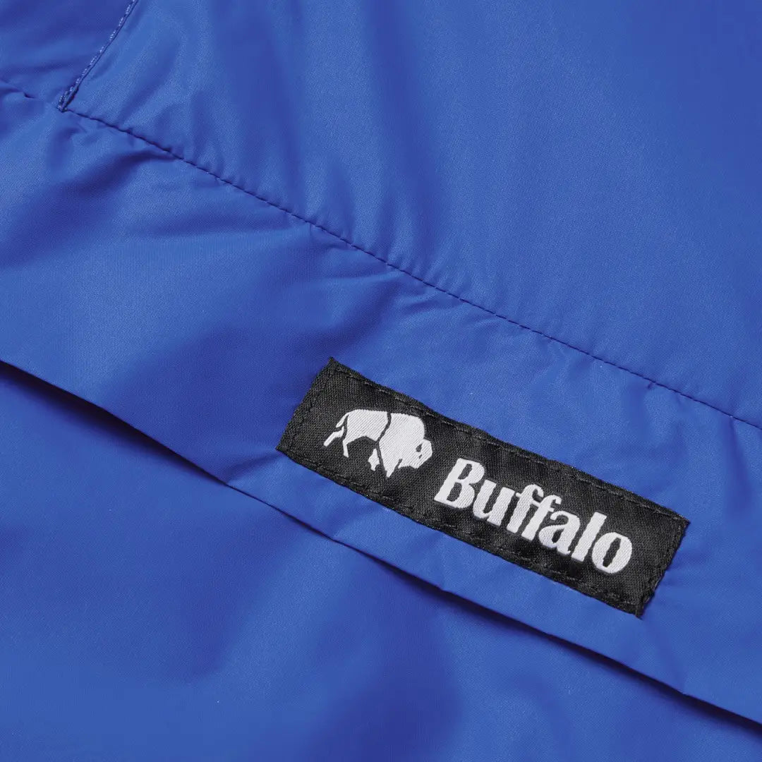 Blue jacket with Buffalo label and white buffalo silhouette for Buffalo Mountain Shirt