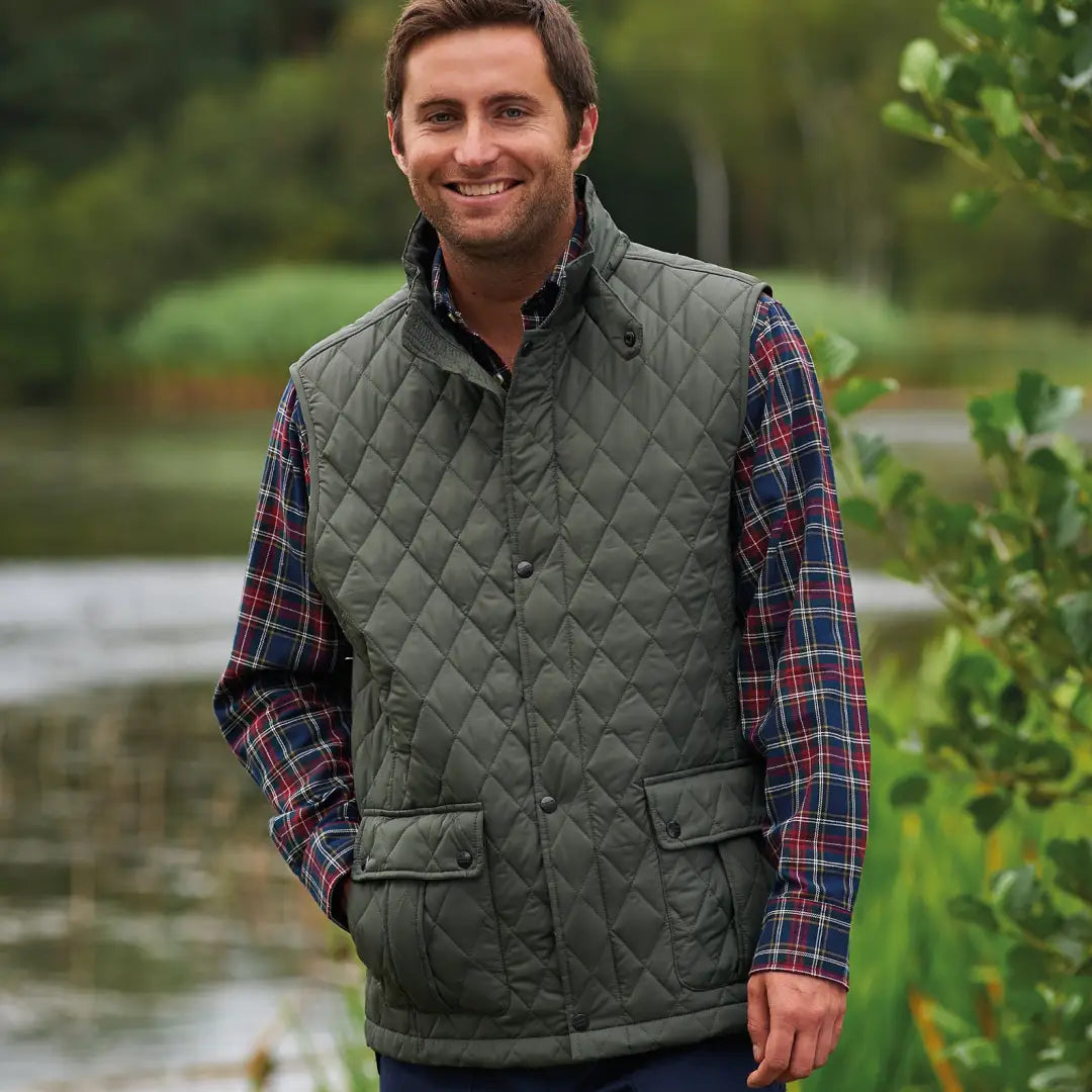 Quilted green vest over a plaid shirt, featuring the Champion Ashby Bodywarmer design