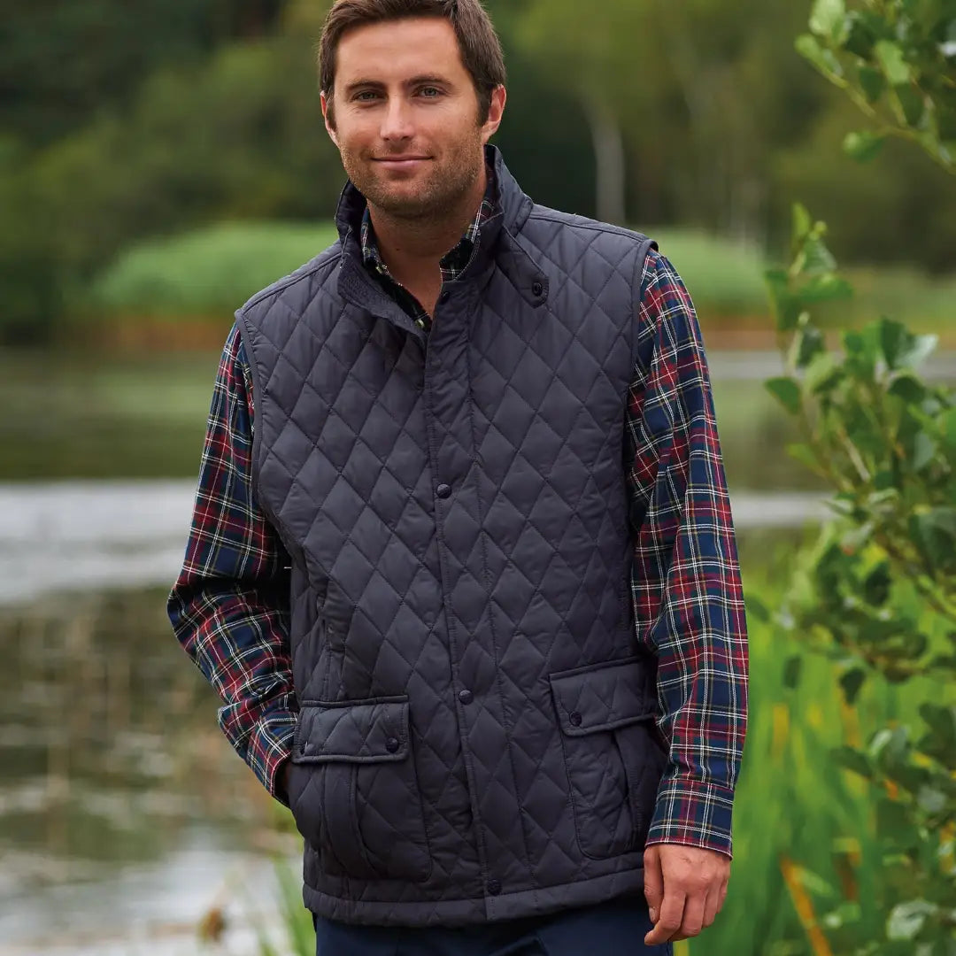 Quilted navy vest over a plaid shirt, perfect for the Champion Ashby Bodywarmer look