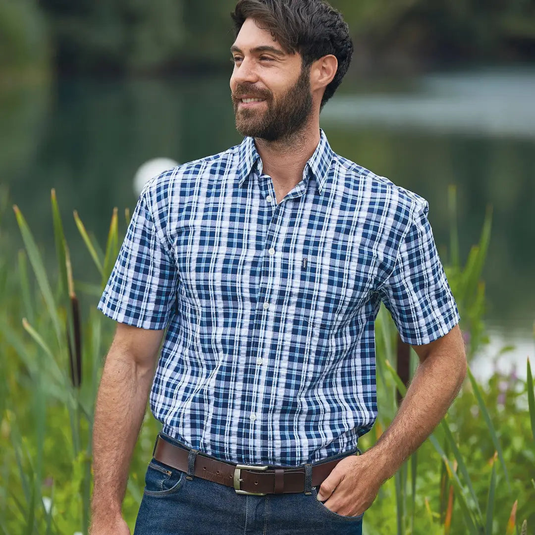 Man rocking a Champion Croyde Short Sleeved Shirt in blue and white plaid