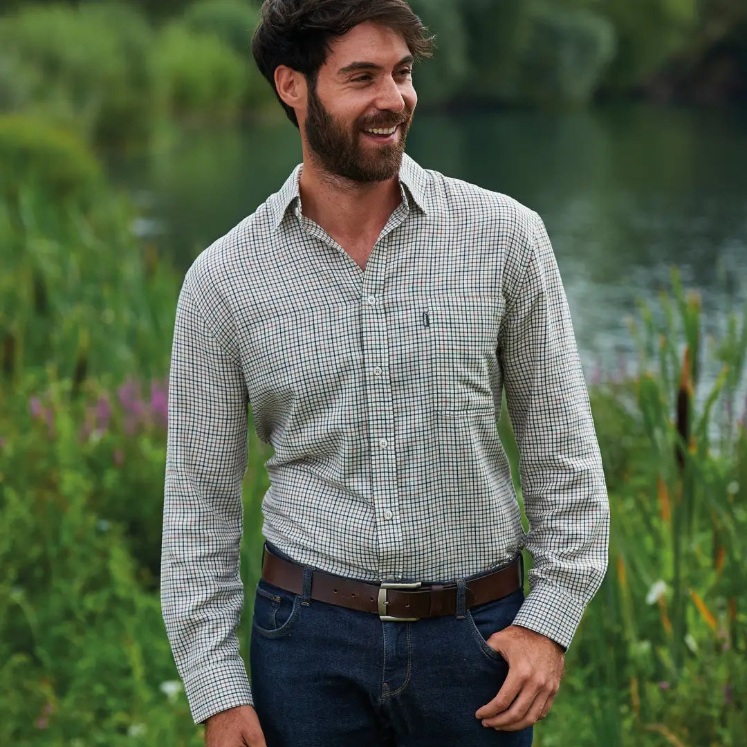 Man in a checkered button-down shirt and jeans showcasing Champion Epsom Long Sleeve Shirt