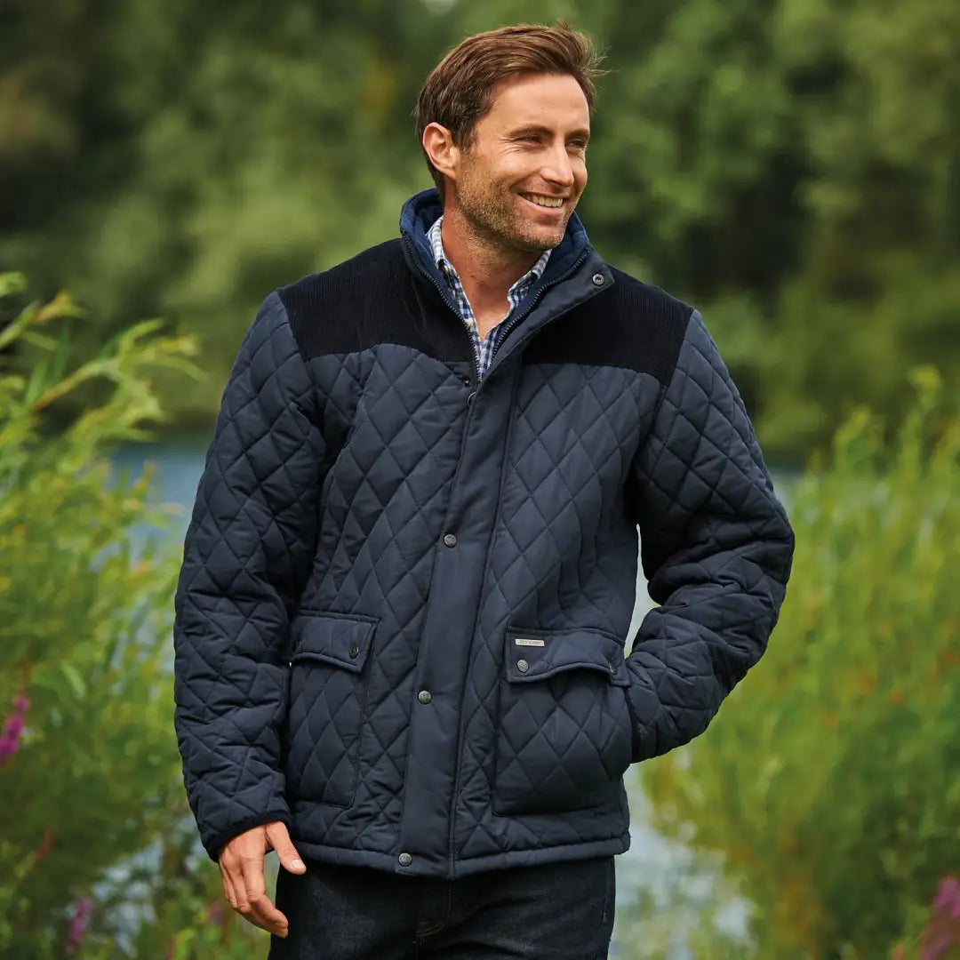 Champion Lewis Quilted Jacket in navy blue with black shoulder panels and collar