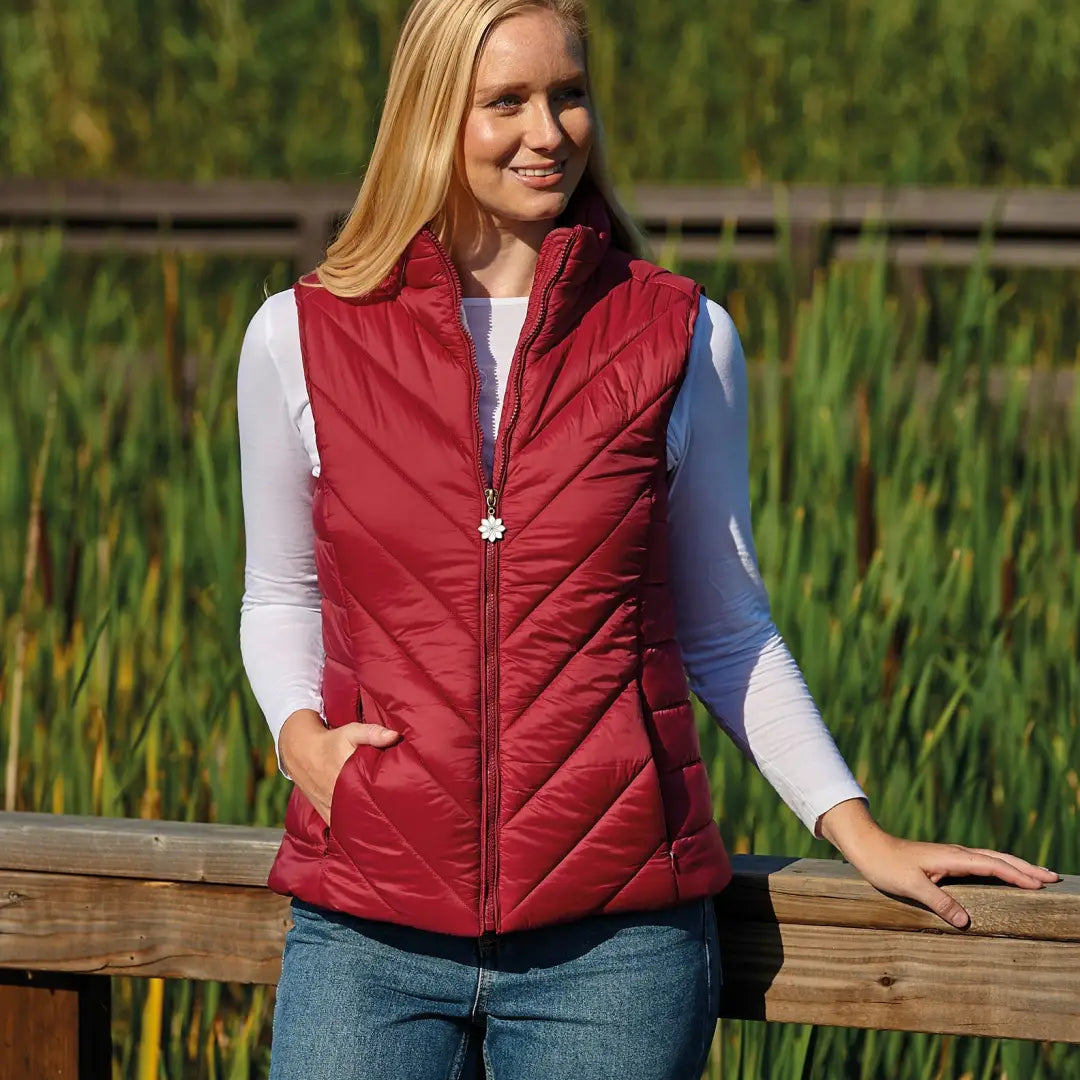 Red quilted vest over white shirt from Champion Lundy Ladies Quilted Gilet collection