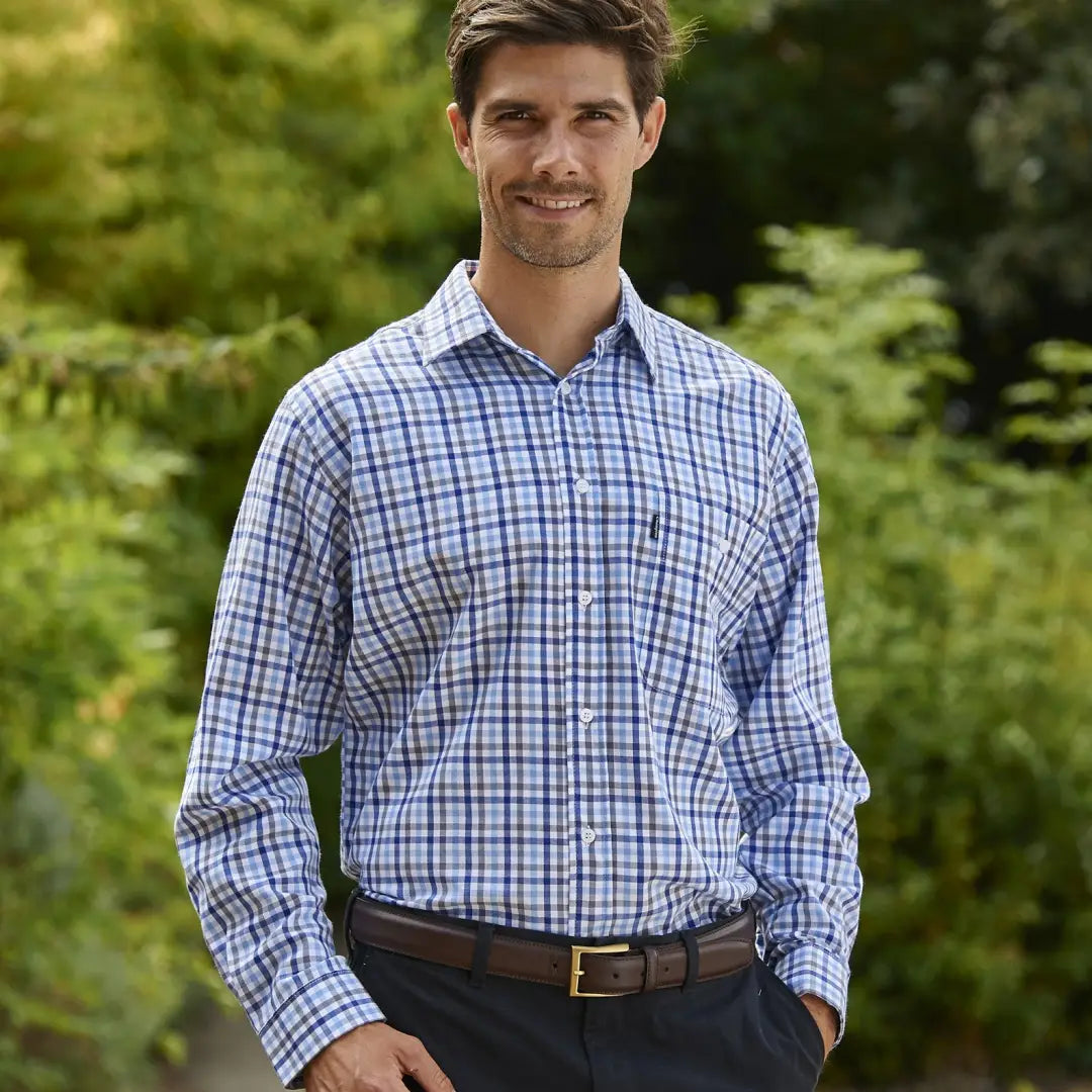 Smiling man in a Champion Lyndhurst Long Sleeved Shirt with blue and white checks