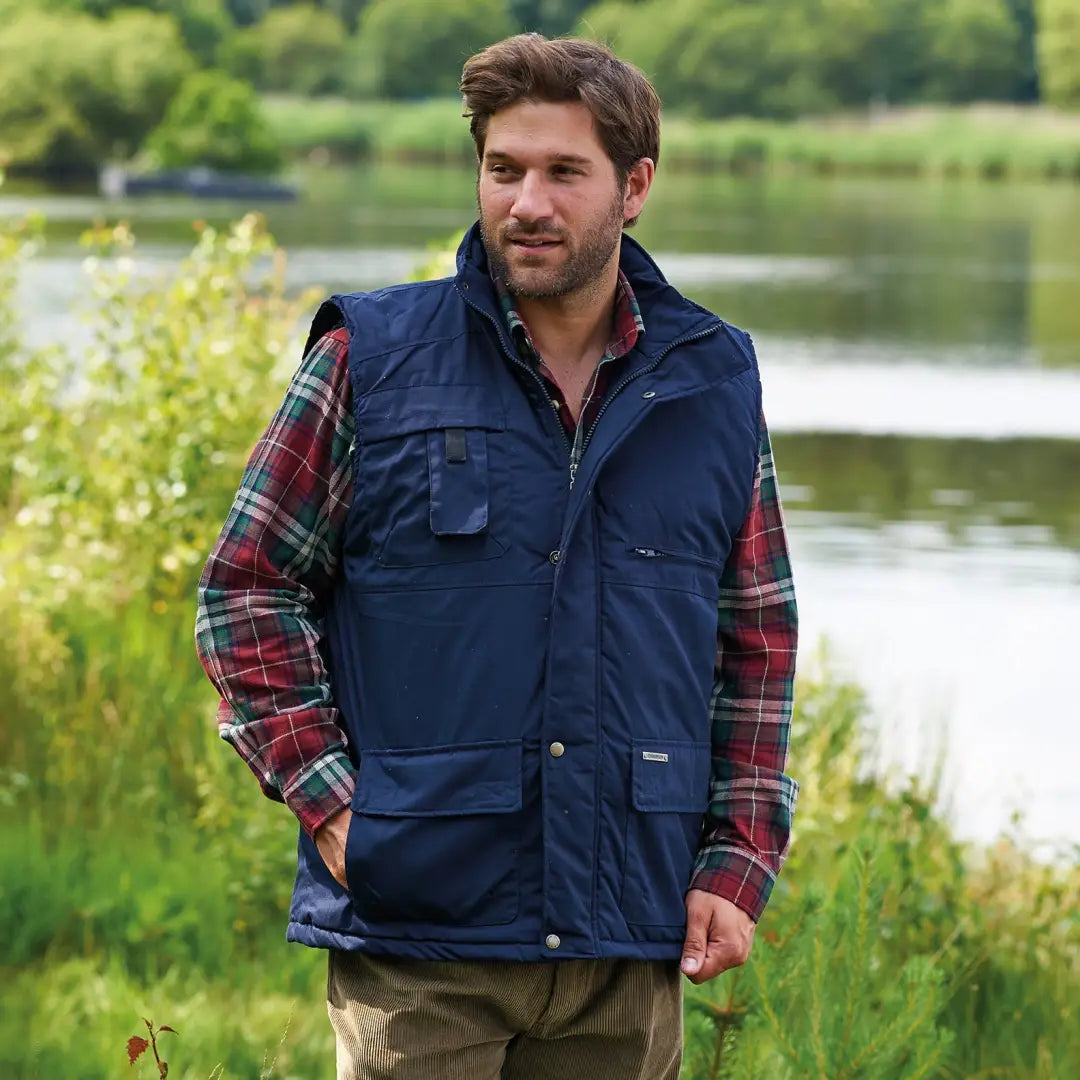 Navy blue sleeveless Champion Peak Bodywarmer over a stylish plaid shirt