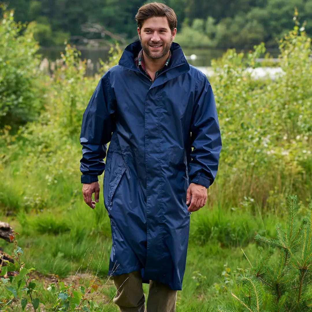 Smiling man in a Navy blue Champion Storm Long Coat outdoors, ready for any weather