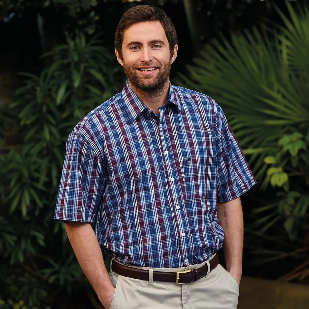 Smiling man in a Champion Whitby short sleeved shirt and khaki pants