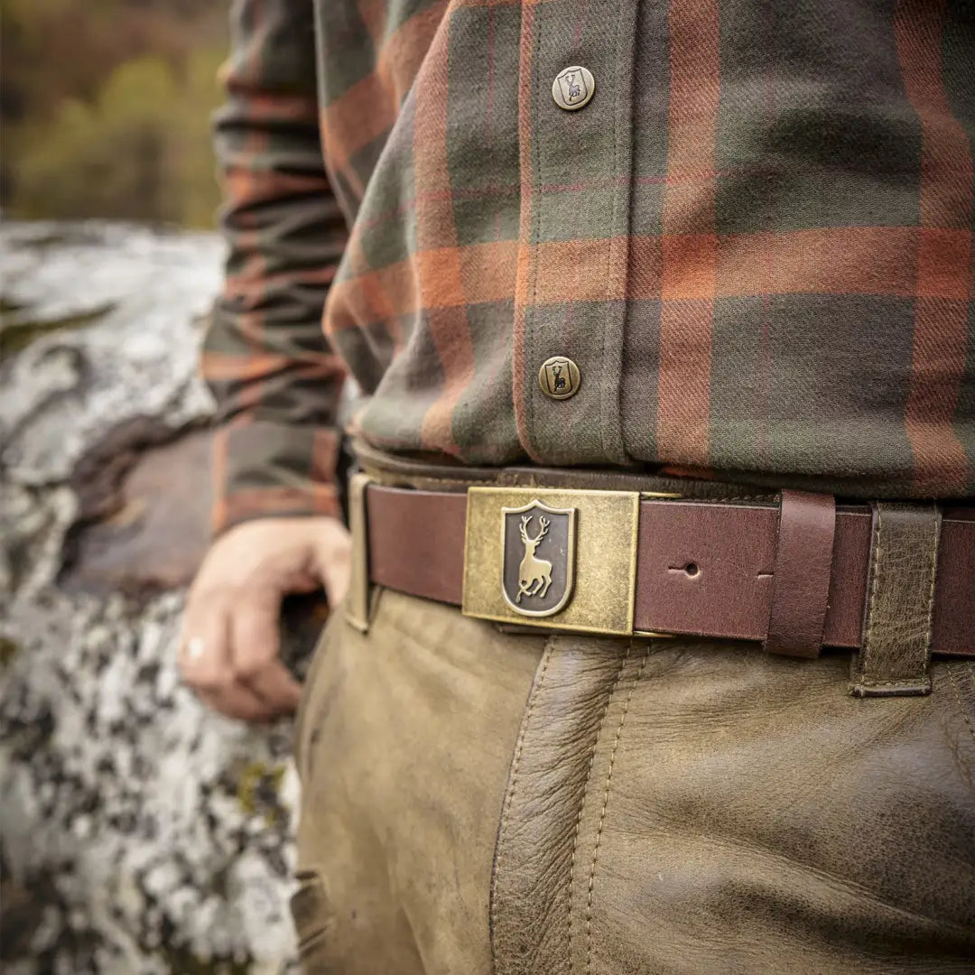 Belt buckle with shield emblem on Deerhunter Adjustable Leather Belt for rugged style