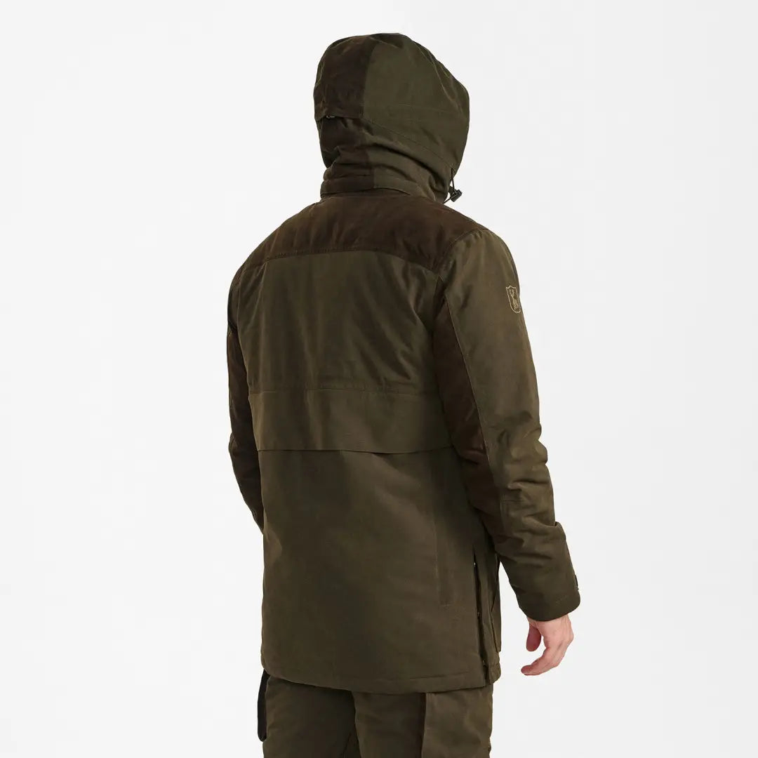 Dark green hooded Deerhunter Eagle Winter Jacket seen from the back for winter adventures