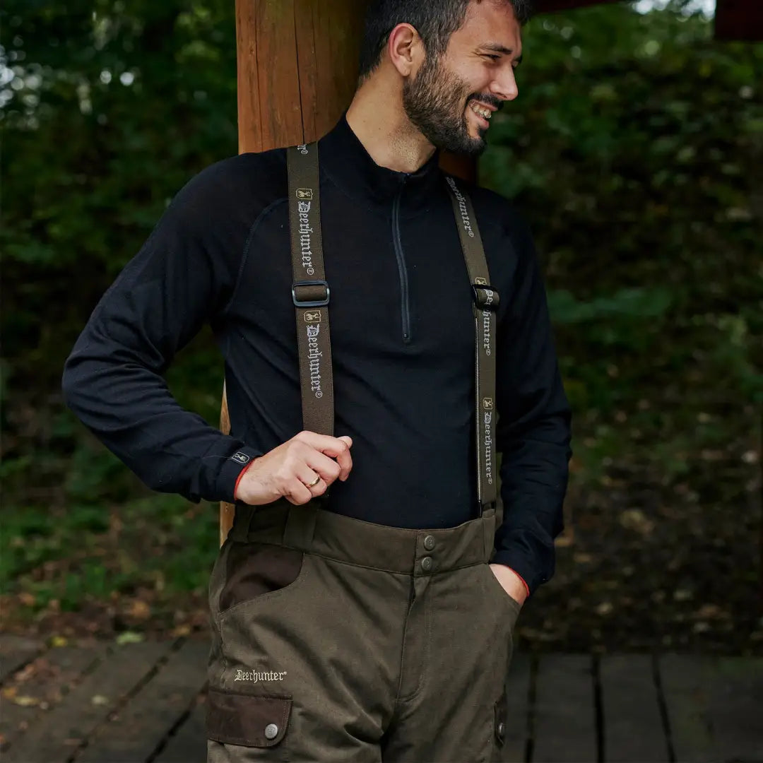 Man in dark clothes and suspenders modeling Eagle Winter Trousers