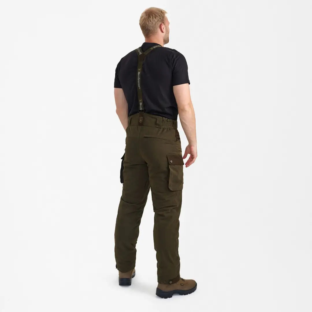 Olive green cargo pants with suspenders styled with a black t-shirt, perfect Eagle Winter Trousers