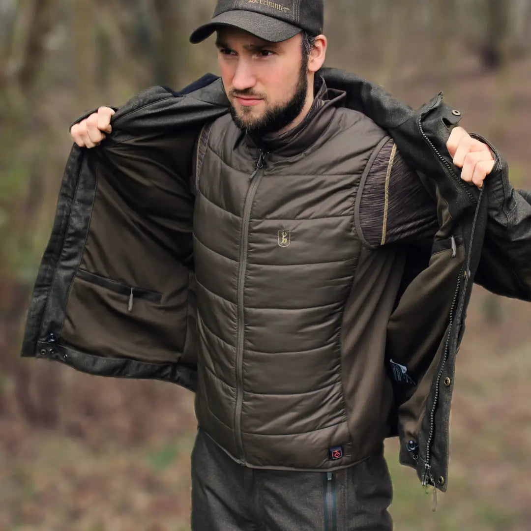 Person showcasing Deerhunter Heat Inner Waistcoat with integrated heat features