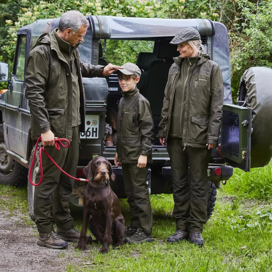 Off-road utility vehicle with three people and a dog near Deerhunter Lady Chasse Jacket