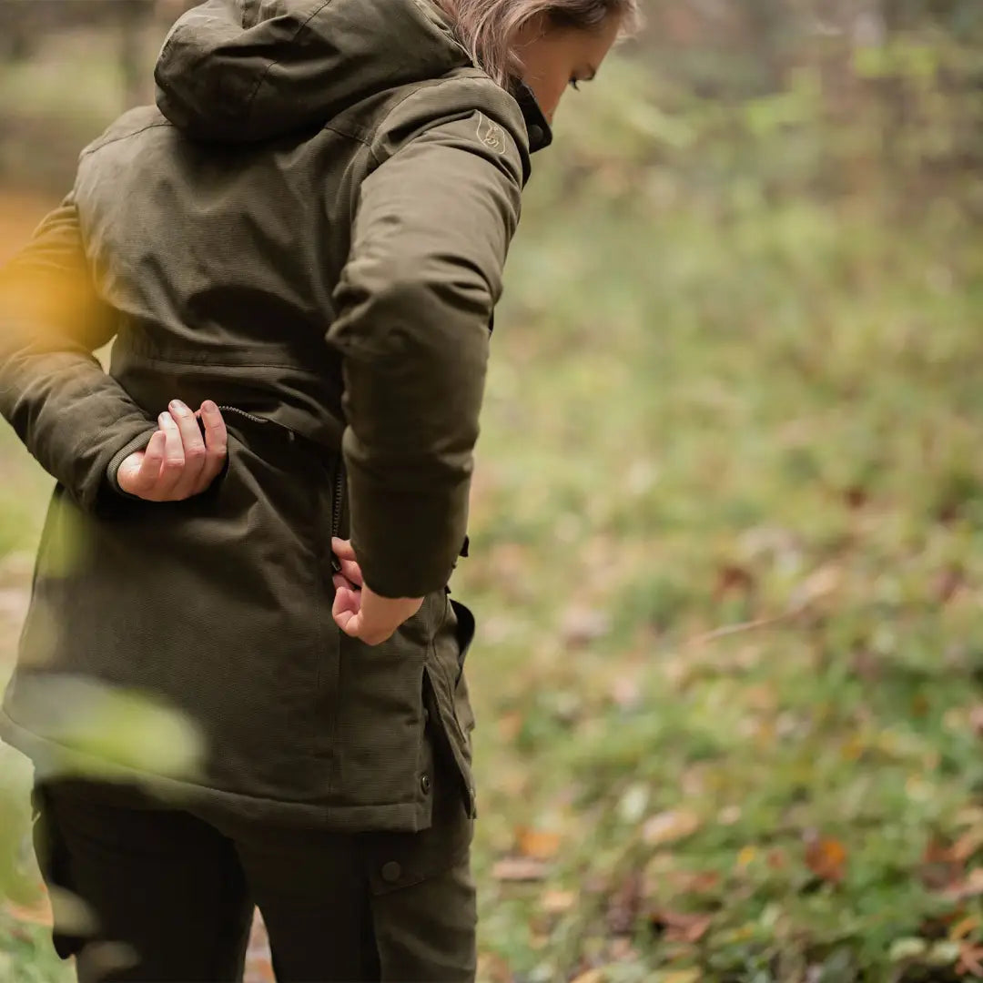 Person in a dark green coat outdoors in the Deerhunter Lady Eagle Winter Jacket