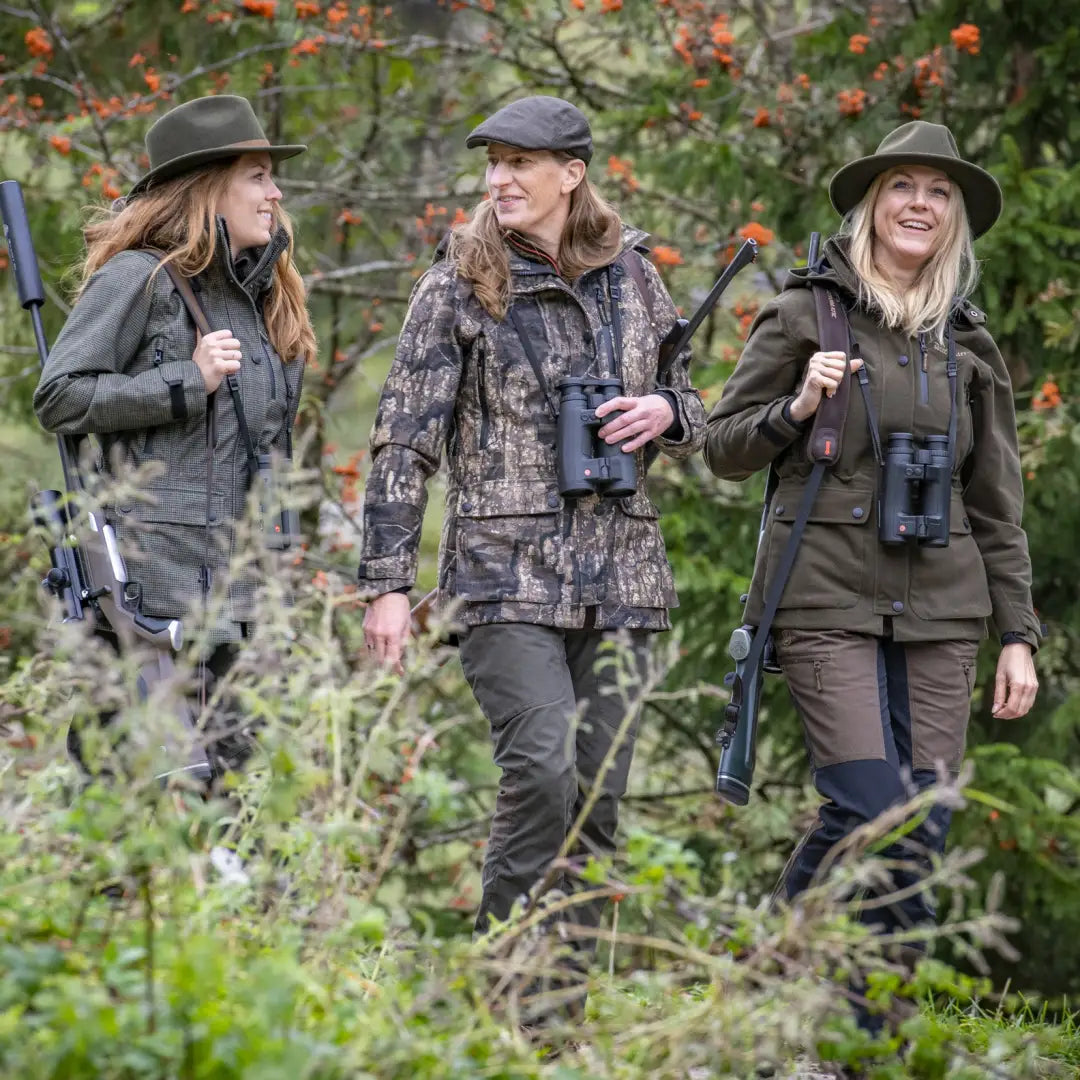 Three women in outdoor gear enjoying nature, showcasing the Lady Gabby Jacket