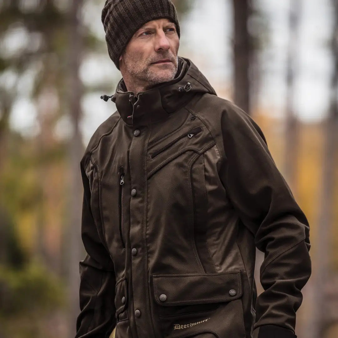 Middle-aged man in dark brown Deerhunter Muflon Light Jacket and black knit hat