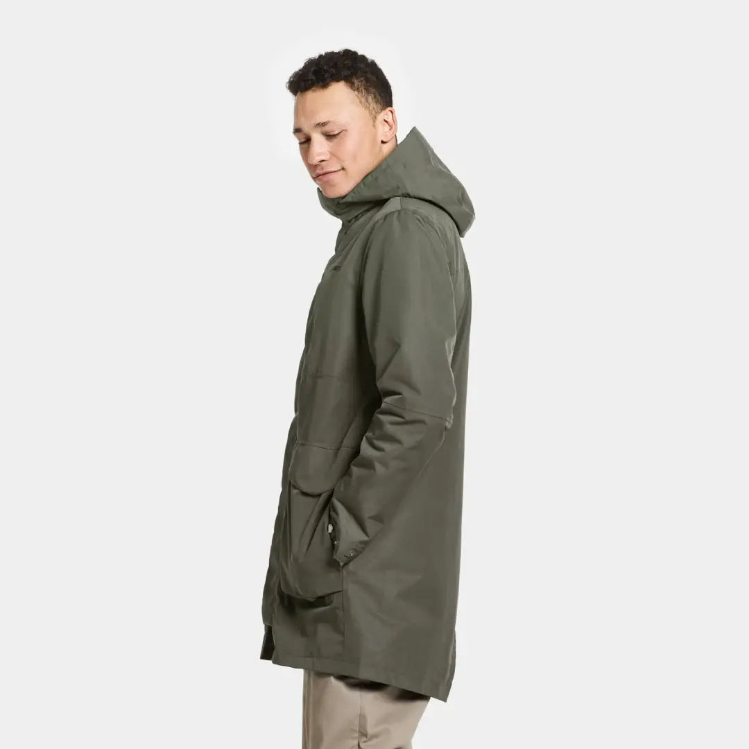 Olive green hooded winter coat worn by a person showcasing Didriksons Andreas Parka