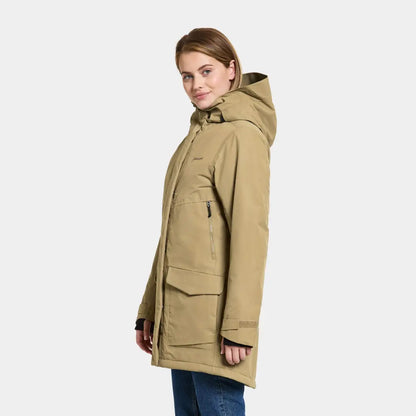 Beige hooded winter coat on a woman showcasing Didriksons Frida Womens Parka 7 style