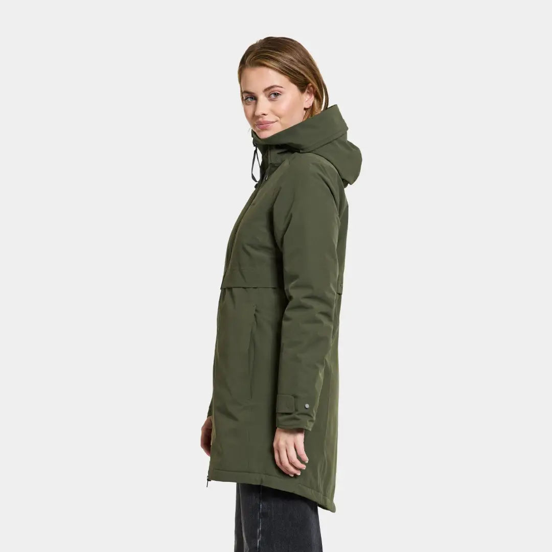 Olive green hooded winter coat worn by a model showcasing Didriksons Helle Womens Parka 5