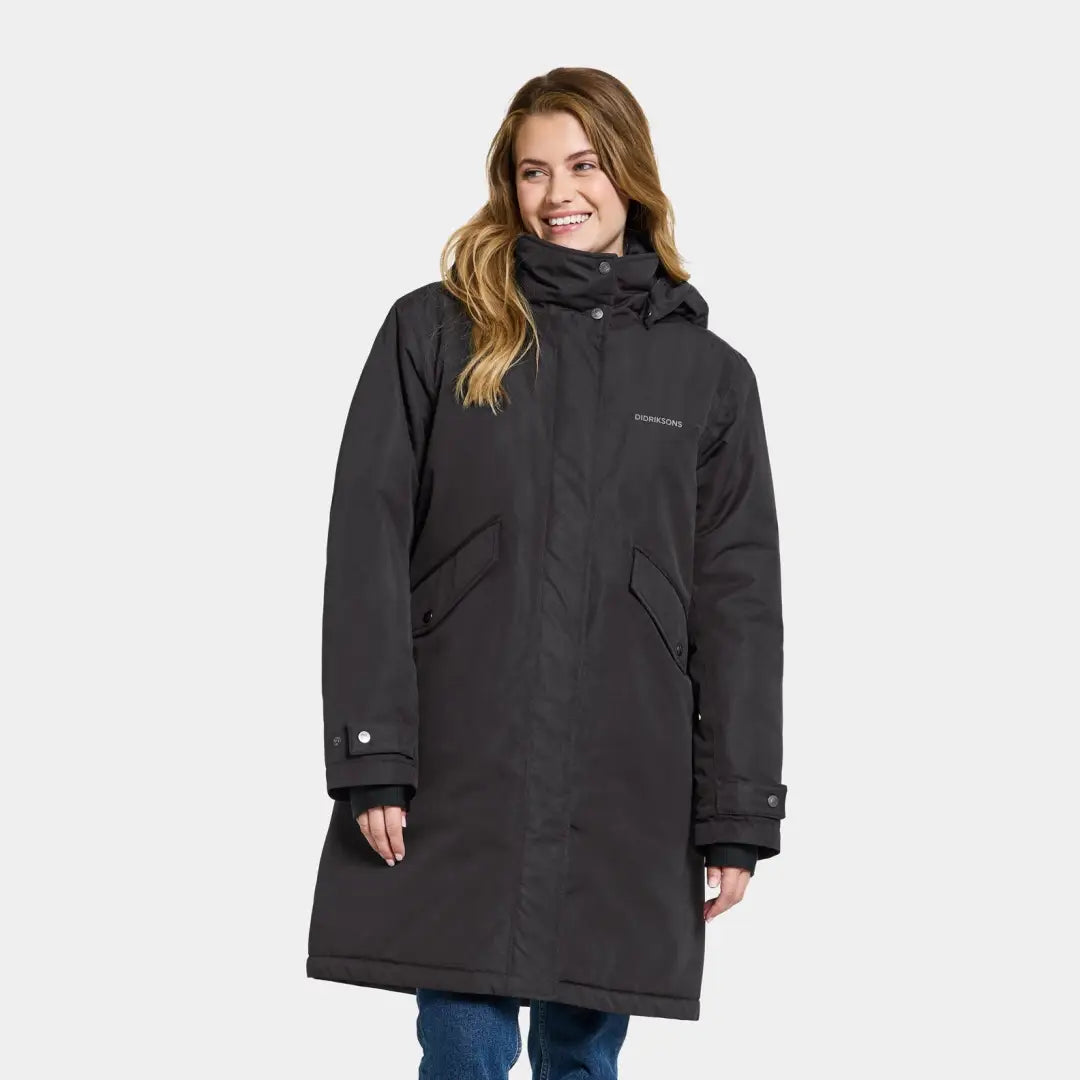 Long black windproof parka with a hood, showcasing Didriksons Josefine Womens Parka 2