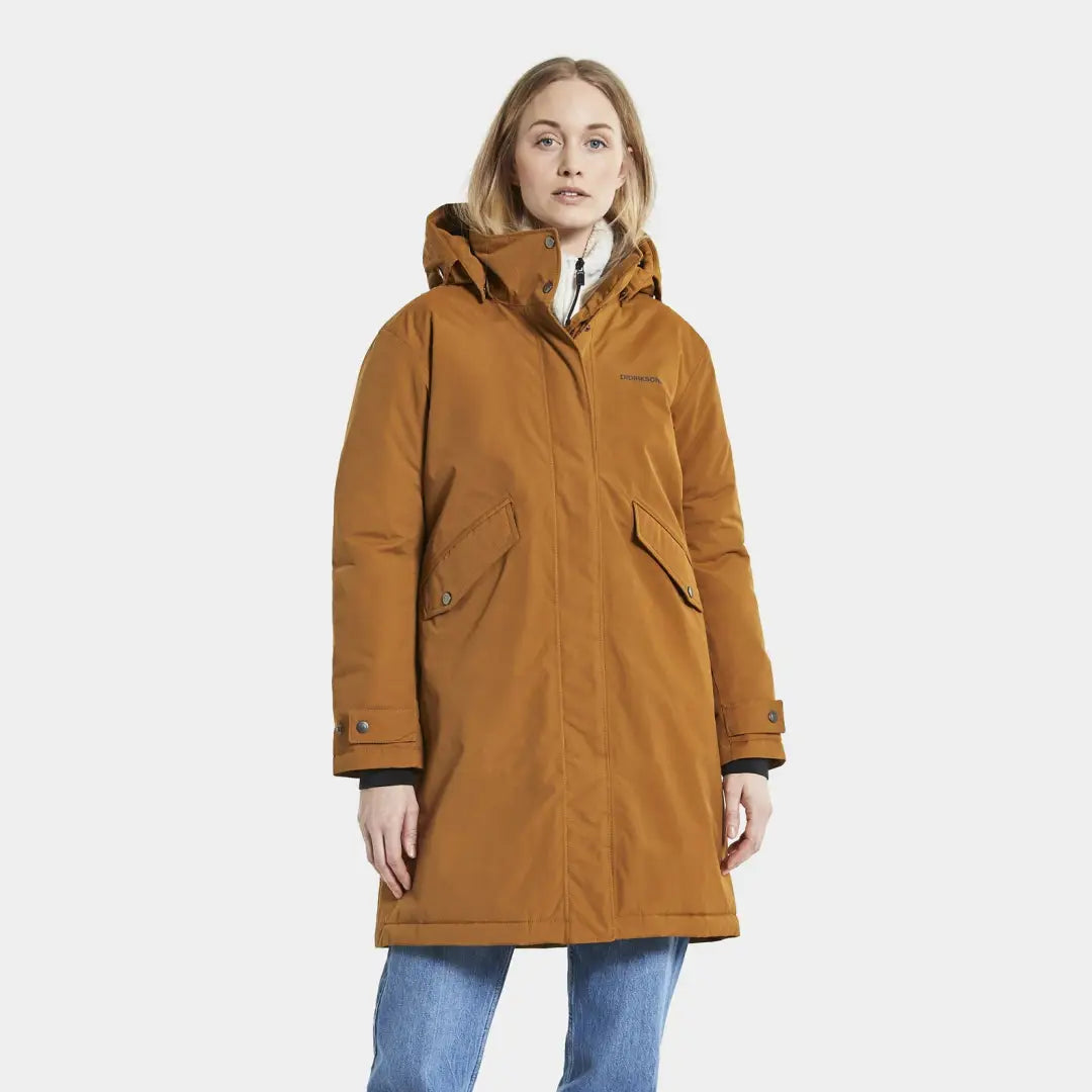 Mustard-colored Didriksons Josefine Womens Parka over jeans for a cozy winter look